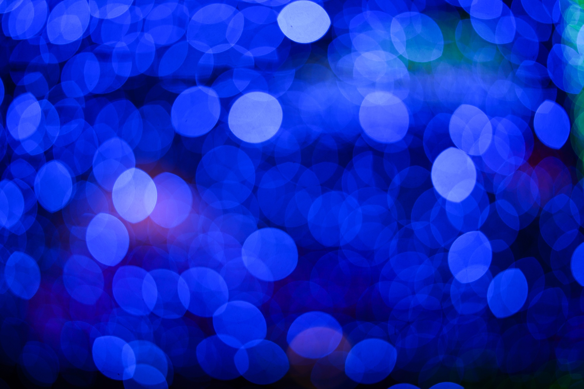 Blue and white bokeh from light bulb abstract background